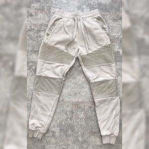 Worn cream track pants
